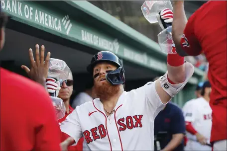  ?? MICHAEL DWYER — THE ASSOCIATED PRESS ?? Boston Red Sox’s Justin Turner celebrates after his solo home run during the fourth inning of a baseball game against the Los Angeles Dodgers, Saturday, Aug. 26, 2023, in Boston.