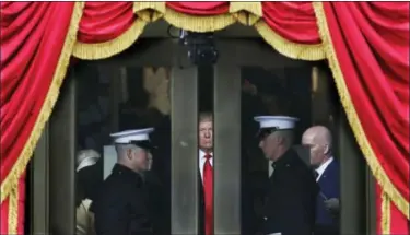  ?? AP FILE ?? Donald Trump waits to step out onto the portico of the U.S. Capitol in Washington for his presidenti­al inaugurati­on Jan. 20.