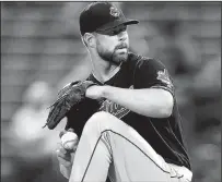 ?? JOHN BAZEMORE/ASSOCIATED PRESS ?? Indians starter Corey Kluber allowed the Braves only three hits in eight innings as Cleveland won its 11th straight game. He says, “No one is really talking about the winning streak.”