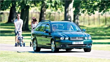  ??  ?? A couple strolling in Windsor Great Park on Sunday were surprised to find the Queen at the wheel of a car which veered on to the grass to get around them. Toby and Scarlett Core were pushing their children along the Long Walk as the Queen was driving...