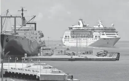  ?? FLORIDA KEYS NEWS BUREAU VIA AP ?? The Empress of the Seas arrives Sunday in Key West. It is the first cruise ship to dock in Key West since Hurricane Irma passed through the Florida Keys. At left is the Empire State, which is housing recovery workers.