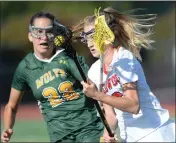  ?? SHERRY LAVARS — MARIN INDEPENDEN­T JOURNAL ?? San Ramon Valley's Brinley Myers, left, gets her stick in front of Redwood's Harper Glass (6) during their NCS D-I lacrosse final at Redwood High in Larkspur on Thursday.