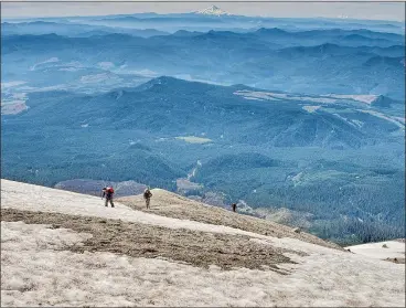  ?? PHOTOS: THE WASHINGTON POST ?? Climbers head up the last 30 metres of Mount St. Helens in Washington. Covered in ash from a 1980 eruption, the upper portion is the toughest.