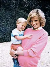  ?? GETTY-AFP ?? Diana holds son William while pregnant with son Harry.