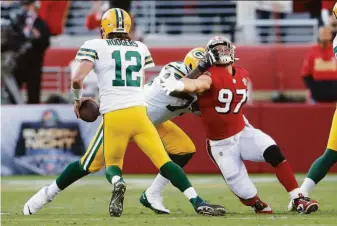  ?? Scott Strazzante / The Chronicle ?? The Packers were able to frustrate the 49ers’ Nick Bosa (97) in his pursuit of Aaron Rodgers in Week 3, and the defense may look to change up schemes against the Seahawks.