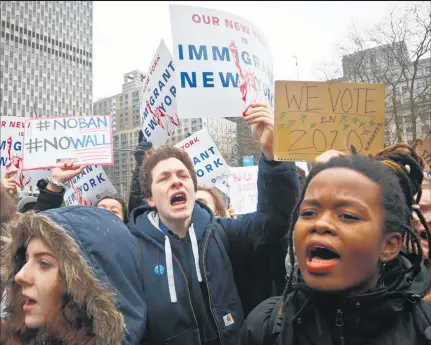  ?? Picture / AP ?? New York students protest against President Trump's executive order banning travel from seven Muslim- majority nations.