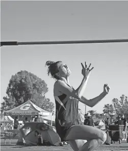  ??  ?? Salpointe Catholic High’s Paris Mikinski competes in the high jump at the 81st Chandler Rotary Invitation­al Track and Field Meet at Chandler High School on April 9.