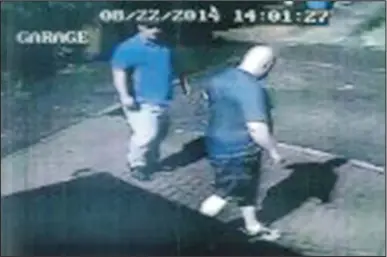  ??  ?? Caught on camera: Shaw and Rooney captured by a neighbour’s CCTV sizing up the house