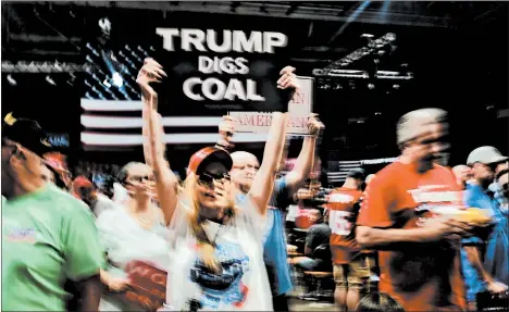  ?? SPENCER PLATT/GETTY ?? While the coal industry still struggles, miners remain supportive of President Donald Trump because they believe he’s on their side.