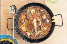  ?? BY MIA YAKEL PHOTOS CONTRIBUTE­D ?? Bulla Paella with Valencia-style rice, seafood, red sofrito and saffron.