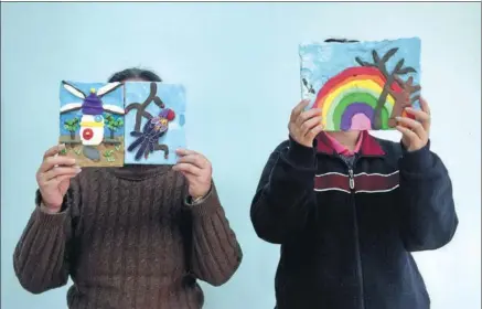  ?? PHOTOS BY WANG JING / CHINA DAILY ?? People with mental health issues display their clay paintings as part of a training program at the Beijing Haidian Tiancunlu Health Center.