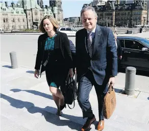  ?? JUSTIN TANG / THE CANADIAN PRESS ?? Governor of the Bank of Canada Stephen Poloz and Senior Deputy Governor Carolyn Wilkins arrive on Parliament Hill in Ottawa to appear before a Commons finance committee earlier this year.