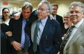  ?? IAN MAULE/TULSA WORLD VIA AP ?? Shannon Kepler celebrates with his attorney, Richard O’Carroll, after a hung jury verdict was announced at the Tulsa Country Courthouse on Friday in Tulsa, Okla. A third mistrial was declared Friday in the murder case of Kepler, a white former Oklahoma...