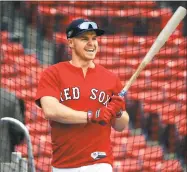  ?? Elise Amendola / Associated Press ?? The Red Sox’s Brock Holt holds a bat at a workout Thursday in Boston.