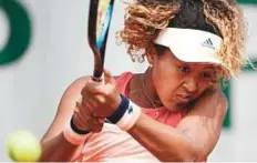  ?? AFP ?? Naomi Osaka plays a backhand return to Sofia Kenin of the US at Roland Garros yesterday. The Japanese won 6-2, 7-5.