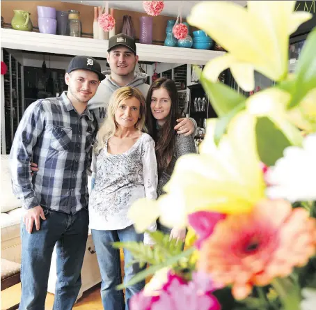  ?? JASON KRYK ?? Cancer victim Ilona Wojdylo, seen here with her children Christian, left, Patrick and Jessica this week in Windsor, has been treated for breast and spinal cancer but will travel to Mexico this month to pursue alternativ­e care options.