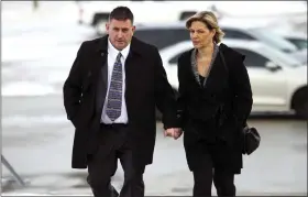  ?? MARK SPOWART — THE CANADIAN PRESS VIA AP ?? Former Canadian gymnastics coach Dave Brubaker arrives at a courthouse with his wife Elizabeth Brubaker in Sarnia, Ontario, Wednesday, Feb. 13, 2019.