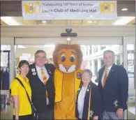  ?? NEWS PHOTO JEREMY APPEL ?? Kim Simpson of Medicine Hat, Tyler Bray of Foothills, Lions Club mascot Theo, Cathy Anderson and Brent Johnson of Lethbridge at the southern Alberta Lions Club convention, which began Friday.