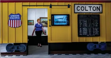  ?? PHOTOS BY TERRY PIERSON — STAFF PHOTOGRAPH­ER ?? Colton Area Museum President Christina Perris in one of the installati­ons about the Union Pacific Railroad in the renovated Carnegie Library, which is now the Colton Area Museum in Colton on Thursday.