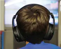  ?? Associated Press ?? ■ Henry Hailey, 10, plays Fortnite online in the early morning hours in the basement of his Chicago home. His parents are on a quest to limit screen time for Henry and his brother. The boys say they understand sometimes, but also complain that they get less screen time than their friends.