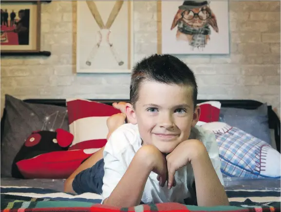  ?? JULIE OLIVER ?? Kristi Blok of Kiki Interiors created an accent wall in her nine-year-old son JD’s bedroom out of peel and stick wallpaper that looks like whitewashe­d brick.