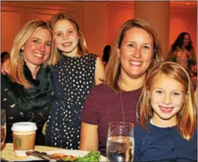  ??  ?? Carolyn Harkins of St. Davids and daughter, Evie, attend the pre-performanc­e party with Noelle Heckscher of Villanova and her daughter, Stephanie.