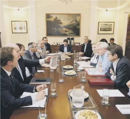  ??  ?? 0 Northern Ireland Secretary Karen Bradley, Brexit Secretary David Davis and Business Secretary Greg Clark (seated on right) take part in a meeting at Stormont House in Belfast to discuss future customs arrangemen­ts with the EU after Brexit