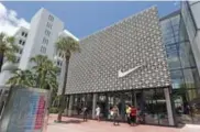  ?? ALAN DIAZ/THE ASSOCIATED PRESS ?? U.S. sneaker retailers say a lack of innovation and catchy styles have depressed demand for Nike shoes.