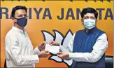  ?? PTI ?? Jitin Prasada joins the BJP in the presence of Union minister Piyush Goyal in New Delhi on Wednesday.