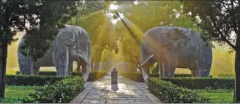  ??  ?? Boat tours on the water of Shantangji­e in Suzhou, Jiangsu province. Stone sculptures along the sacred way to Ming Xiaoling Mausoleum, a famed world cultural heritage site in Nanjing.