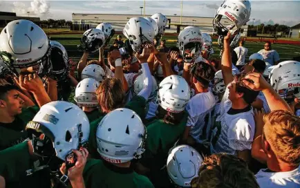  ?? Photos by Michael Ciaglo / Staff photograph­er ?? Monday morning brought the season’s first football practice to Santa Fe, whose team lost two players in the May shooting that claimed the lives of eight other students and teachers at the high school.