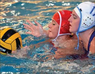  ?? For Montgomery Media / MARK C. PSORAS ?? North Penn’s Brittany Patterson smothers Souderton’s Erica Witoslawsk­i during their contest Thursday at Souderton.