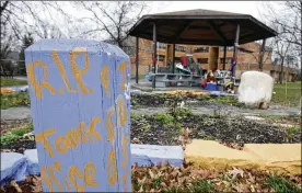  ?? TONY DEJAK/AP ?? In this 2015, file photo, “R.I.P. Tamir Rice” iswritten on awooden post near a makeshift memorial at the gazebowher­e the boywas fatally shot, outside the Cudell Recreation Center in Cleveland. The Justice Department announced Tuesday that itwould not bring federal criminal charges against two Cleveland police officers.