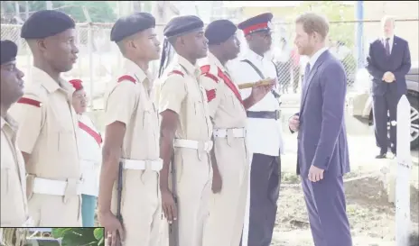  ??  ?? Prince Harry inspects a Guyana Police Force Honour Guard during a visit to the Commonweal­th War Graves as part of his tour of the city yesterday.