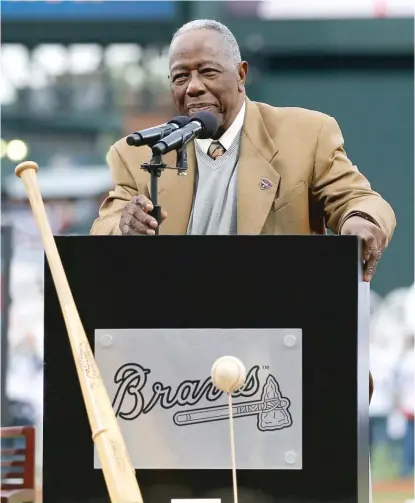  ?? GETTY IMAGES ?? Hank Aaron lived “in constant peace while he probably had every right to be militant and angry,” Chipper Jones said.