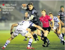  ??  ?? Toby Flood is tackled by Bath’s Josh Bayliss