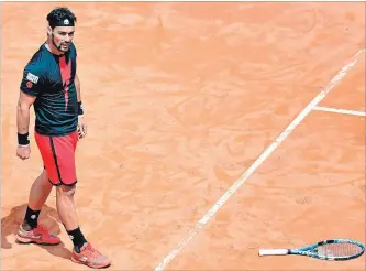  ?? ETTORE FERRARI THE ASSOCIATED PRESS ?? Italy's Fabio Fognini loses is racket during his match against Austria's Dominic Thiem at the Italian Open tennis tournament in Rome on Wednesday. Fognini got the Foro Italico crowd fired up with a 6-4, 1-6, 6-3 win.