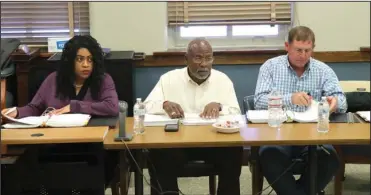  ?? The Sentinel-Record/Richard Rasmussen ?? BUDGET HEARING: From left, Justices of the Peace Esther Dixon, D-District 3, Thomas Anderson, D-District 2, and Ronald Hunter, R-District 11, listen to the county’s 2020 budget proposals during Wednesday’s hearing in the County Courtroom.