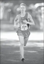  ?? NWA Democrat-Gazette/ANDY SHUPE ?? Fayettevil­le junior Camren Fischer sprints toward the finish line to win the senior high boys 5K race Saturday at Ari Park in Fayettevil­le.