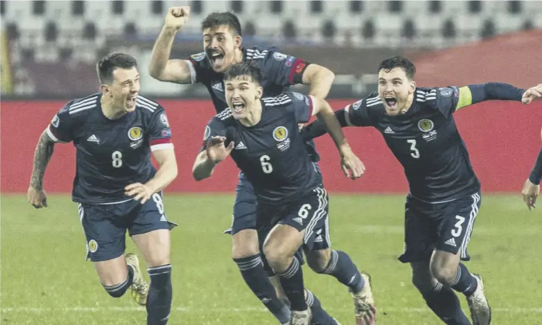  ??  ?? Scotland players begin the celebratio­ns after David Marshall’s shootout- winning save from Aleksandar Mitrovic’s penalty during a dramatic, nerve- shredding Euro 2020 play- off final against Serbia at the Stadion Rajko Mitic in Belgrade.