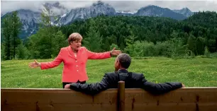  ??  ?? G7 IN GERMANY, 2015: The German Chancellor, Angela Merkel (“about to break into song,” some websites said), with the former President of the United States, a relaxed Barack Obama