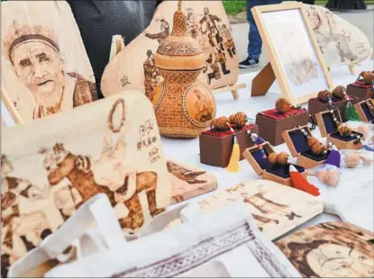  ?? PHOTOS PROVIDED TO CHINA DAILY ?? A stand showcases specialty products from the Xinjiang Uygur autonomous region, at the award ceremony of the 2023 Xinjiang Tour Guide(Docent) Competitio­n.