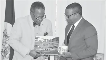  ?? (DPI photo) ?? Vice Chancellor of UG, Prof. Ivelaw Griffith (left) with CDB official, Justin Ram