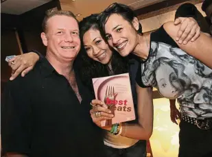  ??  ?? With Edward Hyde of La Bodega and Asha Gill, with whom she wrote a series of children’s books, during the launch of her Best Eats food guide.