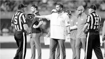  ?? MARK BROWN/GETTY ?? Hurricanes coach Manny Diaz reacts to a non-call against the FIU Golden Panthers on Saturday at Marlins Park.