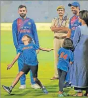  ?? AP ?? Virat Kohli watches Ashish Nehra's son imitate the bowling action of his father (right) at the end of Wednesday’s T20 match.