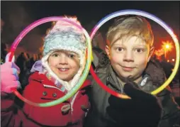  ?? FM4568229 ?? Molly, four, and Elliott Cox, nine, at Maidstone Grammar School’s firework display, pictured left