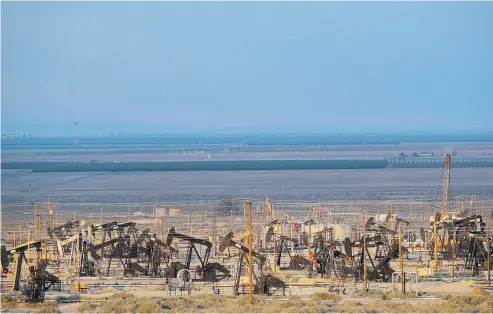  ?? JAE C. HONG / THE ASSOCIATED PRESS ?? Pump jacks near Taft, Calif. The temptation to dive into the rise of crude prices with a simple ETF that tracks the benchmark may seem irresistib­le, but there are benefits and disadvanta­ges to each type of oil ETF, analysts caution.