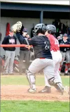  ?? PILOT PHOTOS/ RON HARAMIA ?? Left: Catcher Nathan Marshman shows the umpire the ball after making the tag at home. The runner was called out.