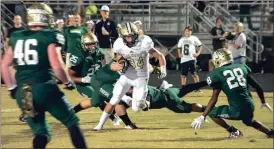  ?? File-TIM GODBEE / For the Calhoun Times ?? Calhoun’s Drew Rutledge (34) looks for running room during an earlier game.